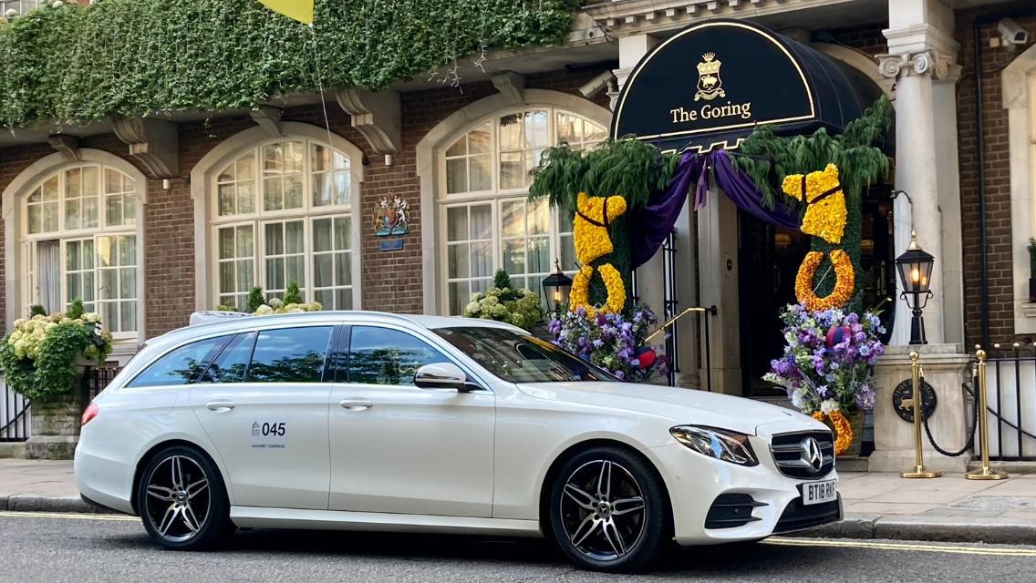Rye Taxi Services - white Mercedes taxi outside a traditional Rye home, ready for your journey