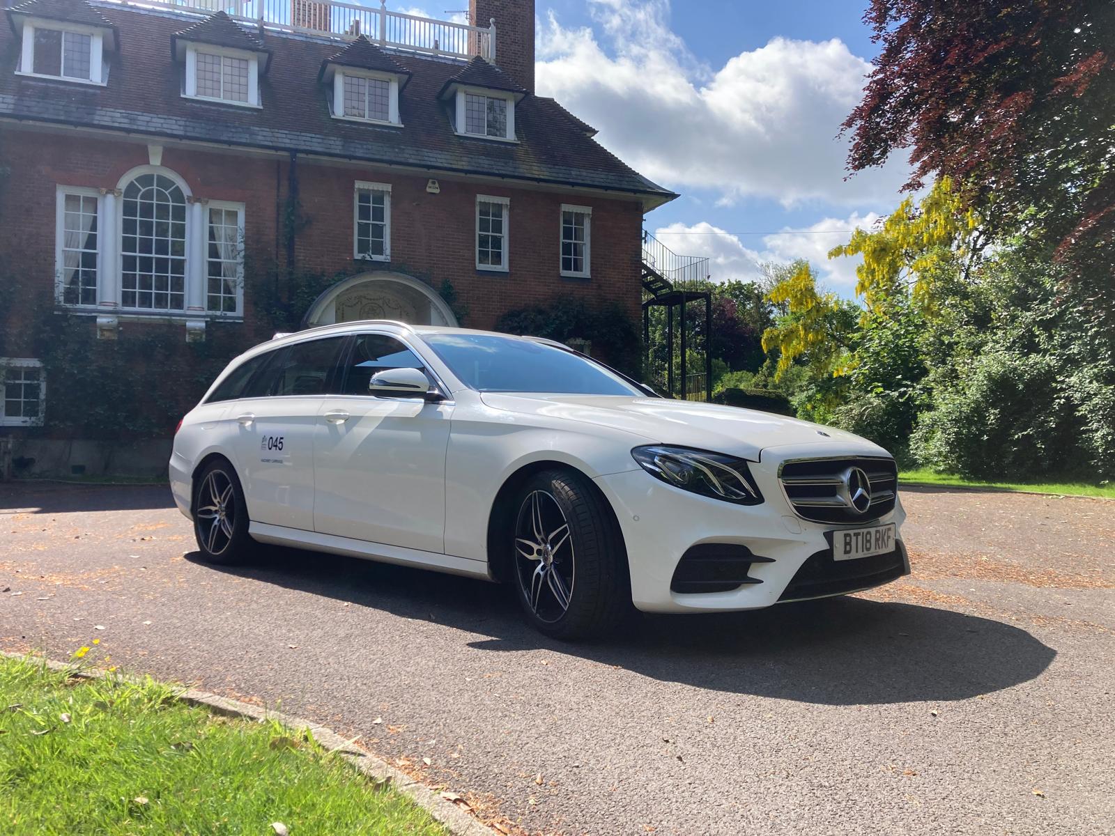 Rye Taxi Services vehicle outside a beautiful Sussex property - reliable local taxi service